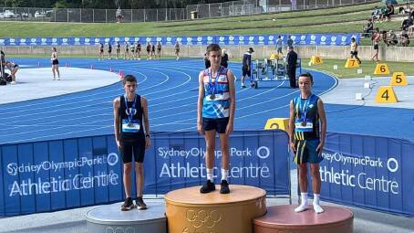 Ryker Moore on the top step for the 400m run event at the Youth State Championships. Image supplied.