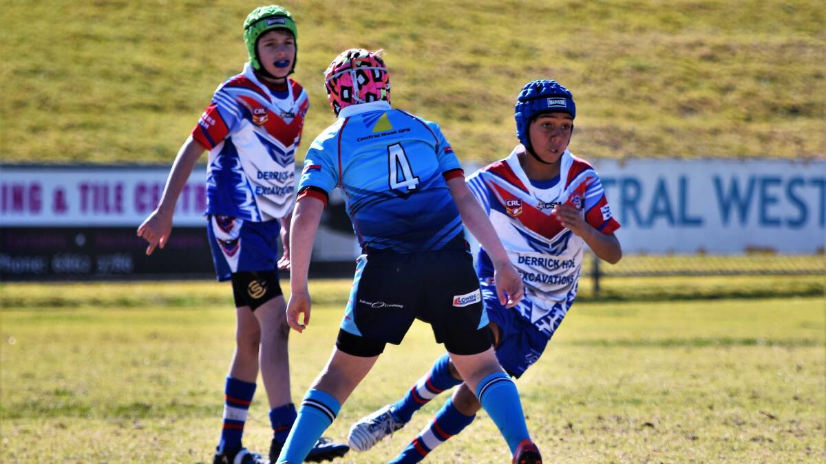 Go Hard: Marist player Brock Bowd dodges a Red Bend tackle in an under 10s match. Photo: Jenny Kingham. Derrick Hoe Excavation under 10s lost to Red Bend last Saturday at home. 