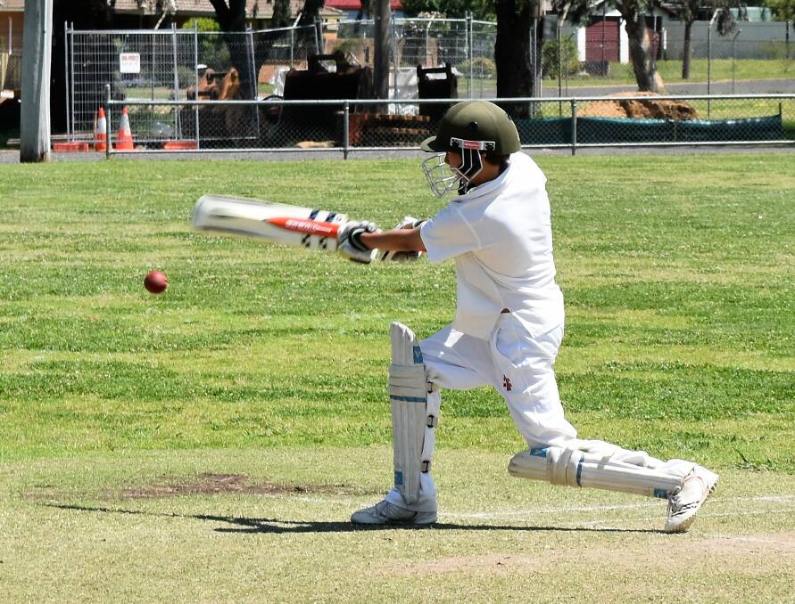 Junior Batsman: Wilson Duffy goes in for the swing during his innings for the under 14s Parkes Dunns during a match against Forbes AWB.