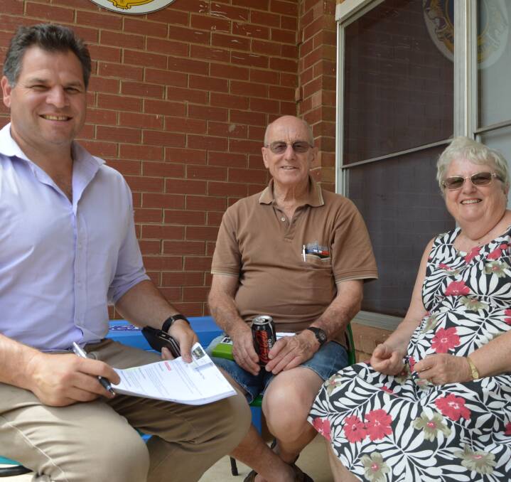 MP Philip Donato had a chat with Parkes residents Derrick and Sandra Milling on Friday. Photo by Barbara Watt. 