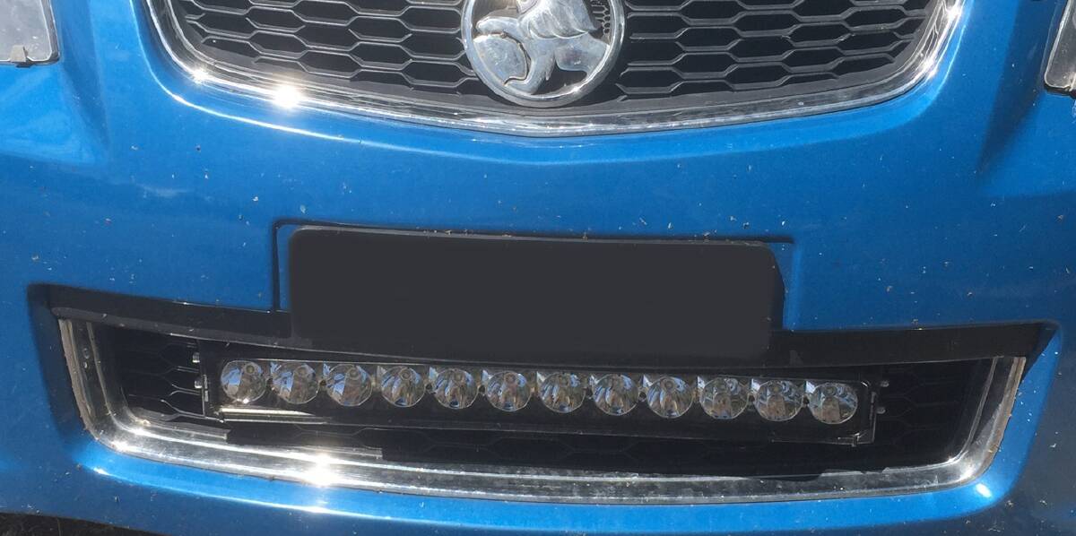 The lightbar on this vehicle is secured by brackets which are attached to the chassis. 
The bolts on the brackets are welded on. 