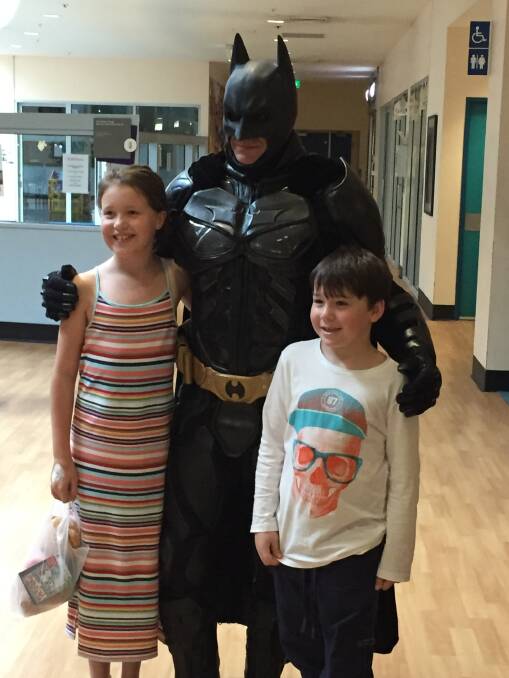 On the morning of her surgery, Abby and her brother Tully had a visit from Batman. 