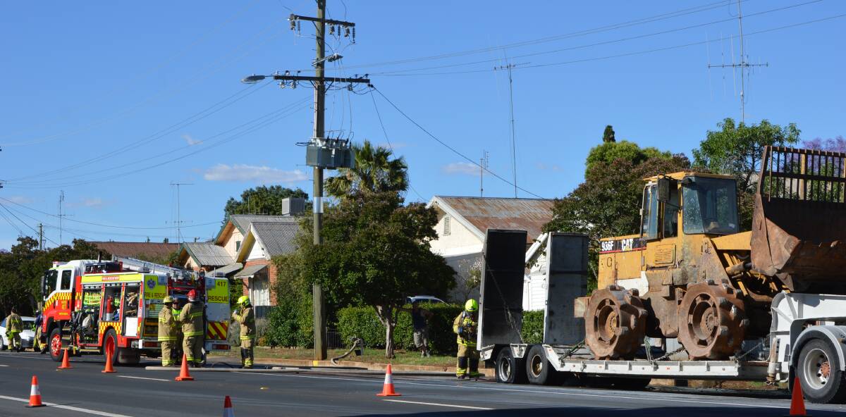 Emergency services were called to Bogan Street on Monday afternoon after the trailer of this truck caught fire. Photo by Barbara Watt. 