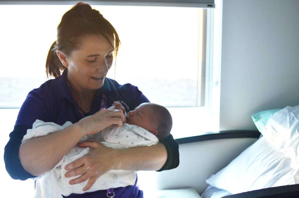 Local Midwife Cath Byrnes with newborn Elsie Mae Ward. Cath cared for Elsie's mum Kellie through her pregnancy journey, birthing and their postnatal care.  
