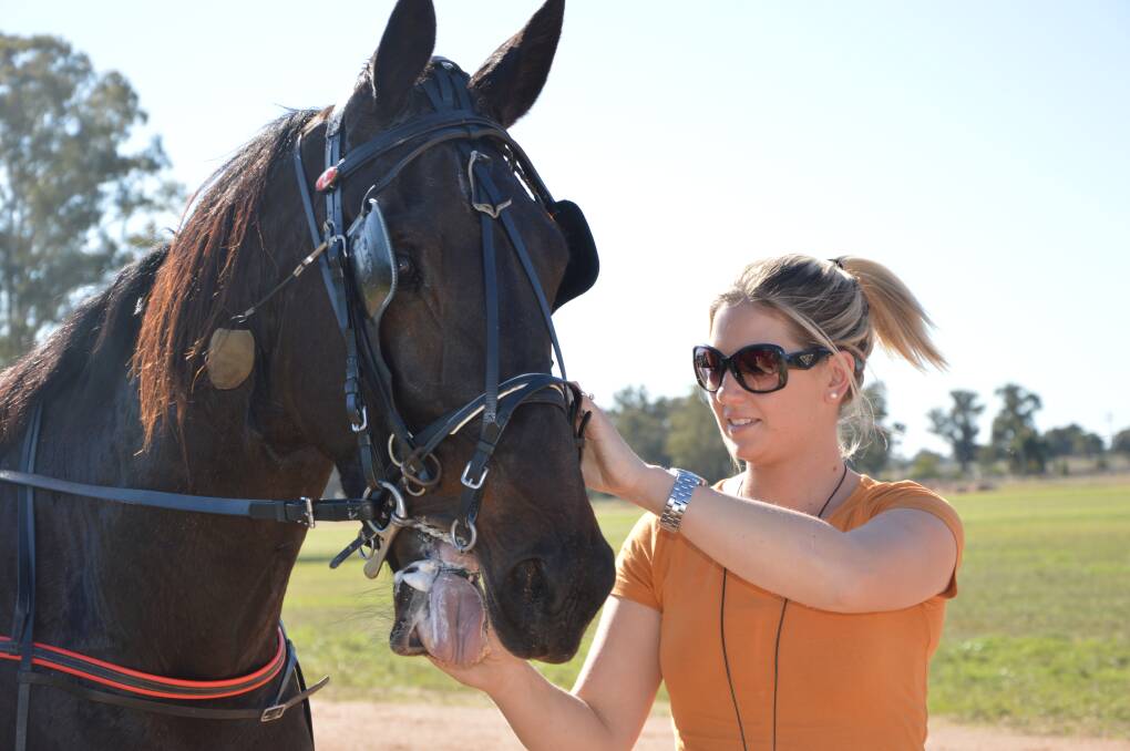 Gemma Hewitt, daughter of Bernie Hewitt and partner of driver Mat Rue is pictured here with one of her father's horses who  was successful at last year's Peak Hill meeting. Gemma and Bernie both have runners at Peak Hill. 