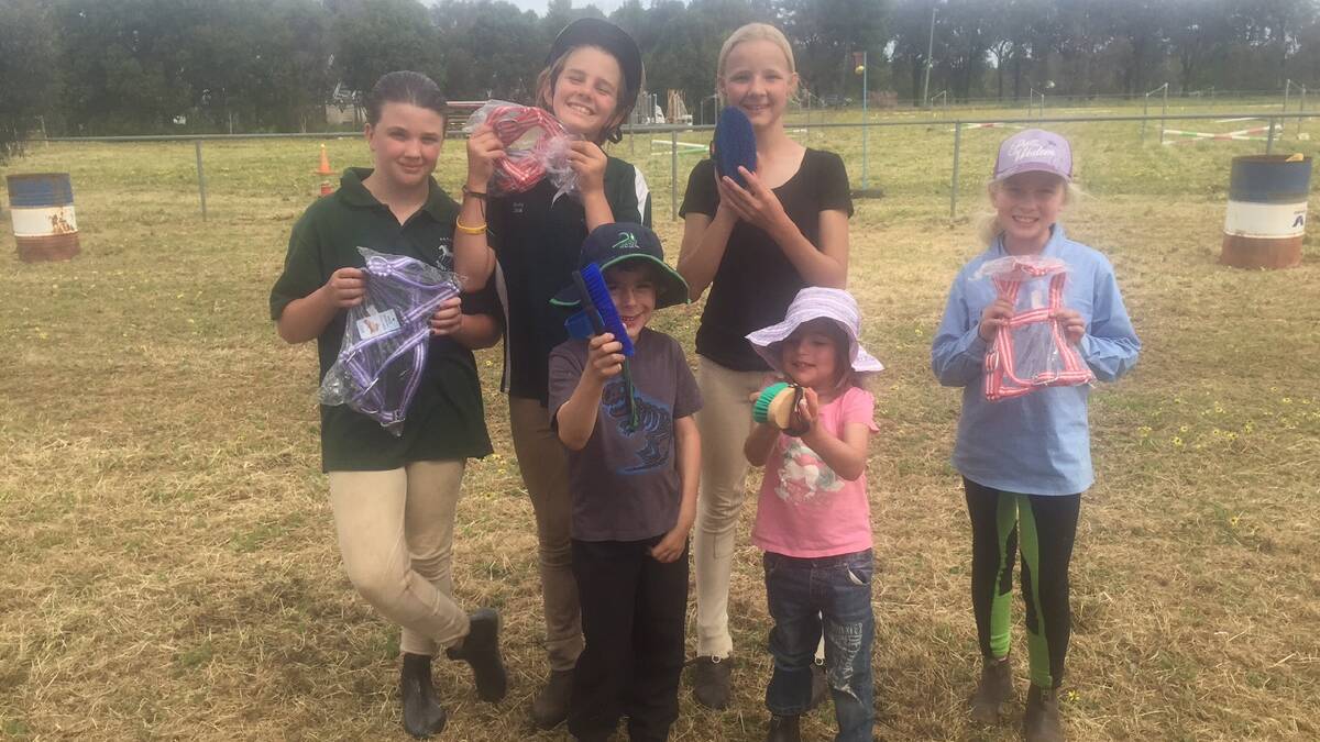 Tylah Mapperson, Ruby Moore, Sophia Burns, Lucy Chapman and front Sam and Olive Morgan with their prizes from the Parkes Farm Centre.   
