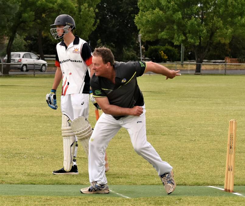 Parkes Sports and Bowling Club bowler Steve McGrath watches intently the result of his delivery. 