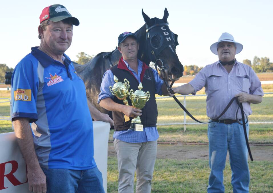 Wagga horse Leucura took out the Parkes Services Club sponsored 123rd Parkes Gold Cup on Sunday. Pictured from left - Parkes Jockey Club president, Mark Ross, trainer Chris Heywood and PJC committee member Ralph Smith. 