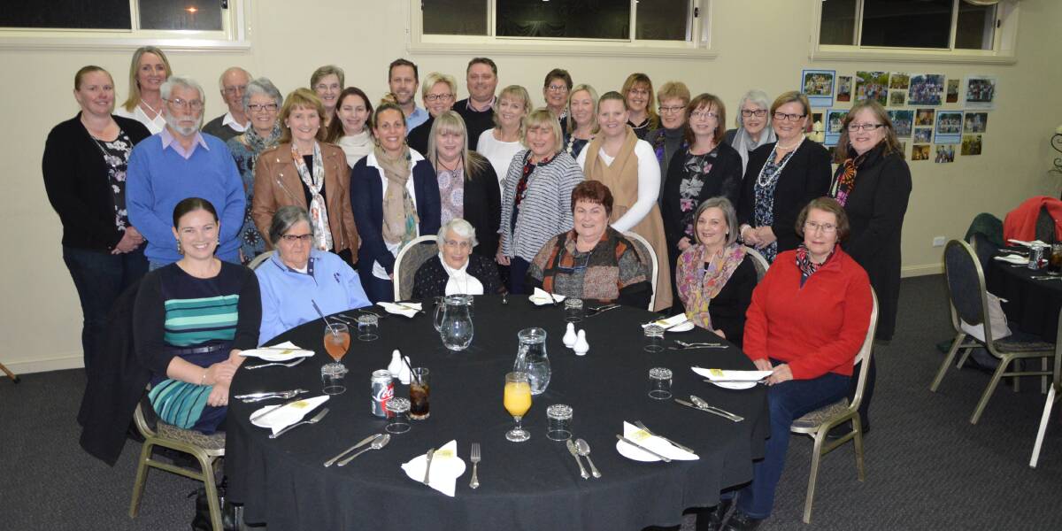 Joan Morice (front, third from right) with past and present Parkes Public School staff and Reading Recovery colleagues at her retirement dinner held at the Comfort Inn Bushman's Conference Centre. Photo by Barbara Watt.
