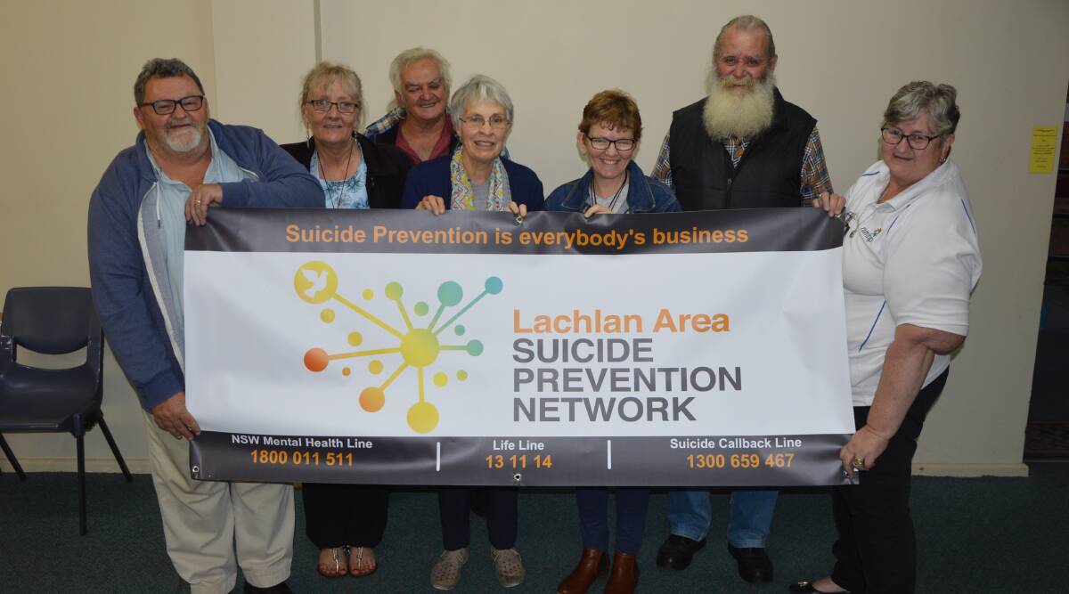 Lachlan Area Suicide Prevention Network members, from left - Ross Bailey, Sandi Bailey, Barney Thompson, Evelyn Shallvey, Pam Cole, Kevin Dumesny and Di Gill with one of the new banners. 