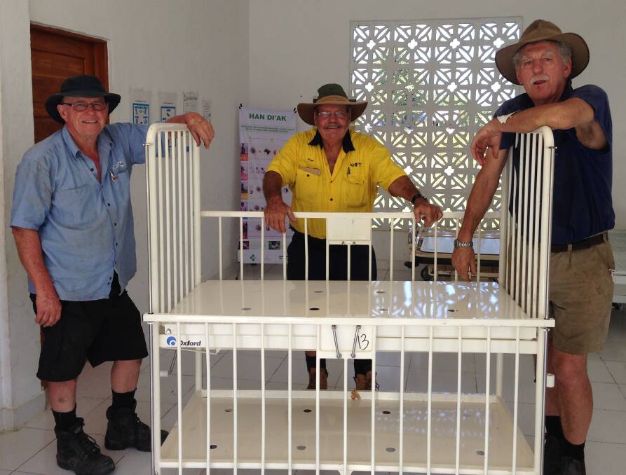 Clinic staff were very excited to have new medical equipment delivered from Australia. Doug Hawken, Roger Hood, and Bill Shallvey had some difficulty maneuvering this cot through the doorways. 