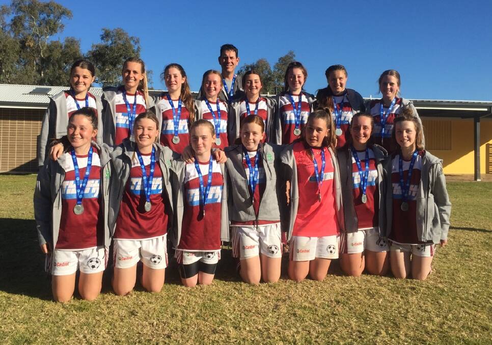 RUNNERS-UP: (Back) Claudia Gorton (Forbes), Grace Osborne (Parkes), Emma Jones (Parkes), Amy Gallagher (Forbes), coach Wayne Osborne, Abby Greenaway (Parkes), Kyah Turnball (Parkes), Mel Reeves (Parkes), and Georgie Norris (Forbes); (front) Chloe Howarth (Forbes), Pascal Berry (Parkes), Sharna Ross (Parkes), Steph Behan (Forbes), Abby Sly (Forbes), Maisy Osborne (Parkes), and Natasha Hodges (Forbes).