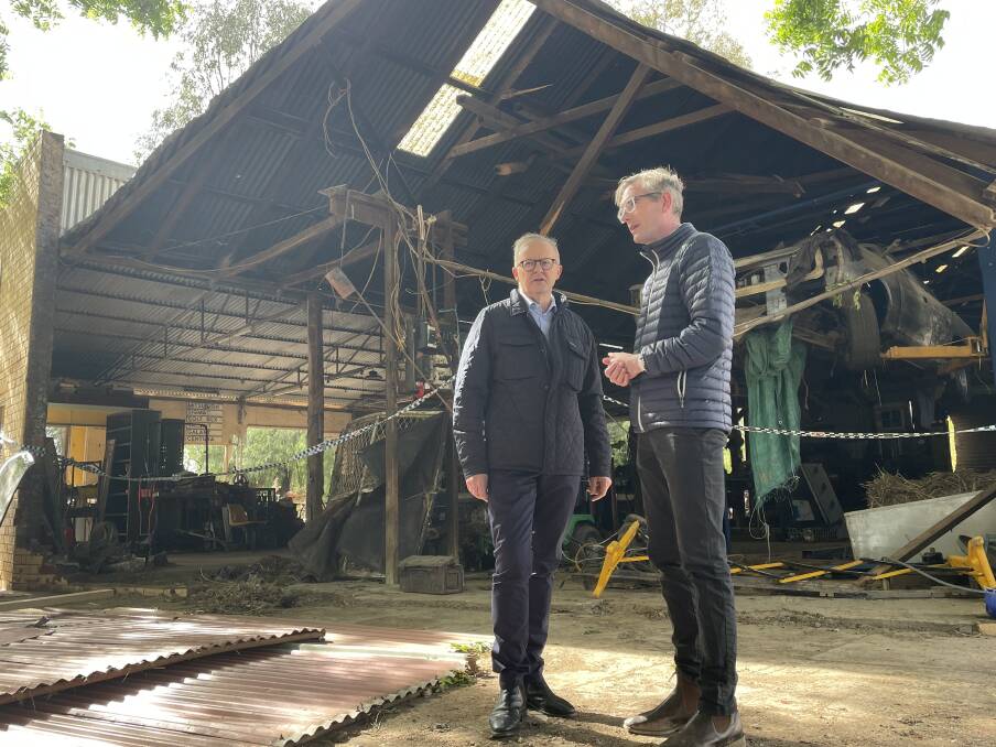Prime Minister Anthony Albanese and then Premier Dominic Perrottet stand in a flood-devastated Eugowra business in November 2022. File picture