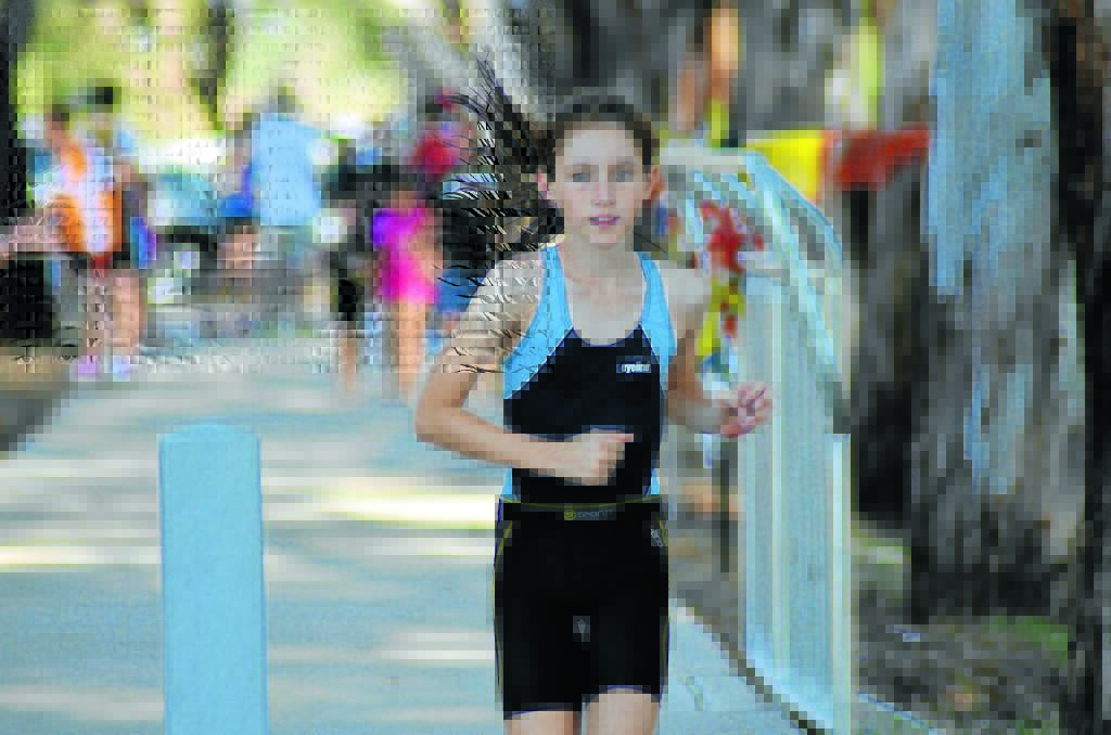 One of the junior entrants on the run leg in last year's triathlon. This year's event is on April 1 and 2 and participants are being urged to register online in advance. 