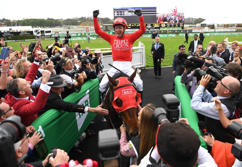 BEST EVER: Co-owners celebrate as jockey Kerrin McEvoy on Redzel returns to scale after winning The Everest race on Saturday. Photo: AAP