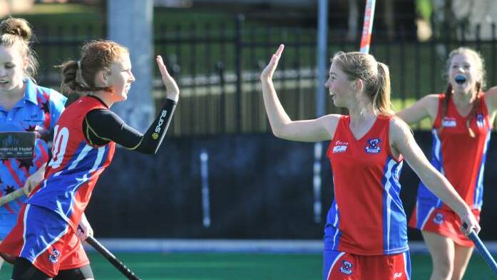 FEDS UP: Grace Evans and Millah Allcorn celebrate a goal. 
