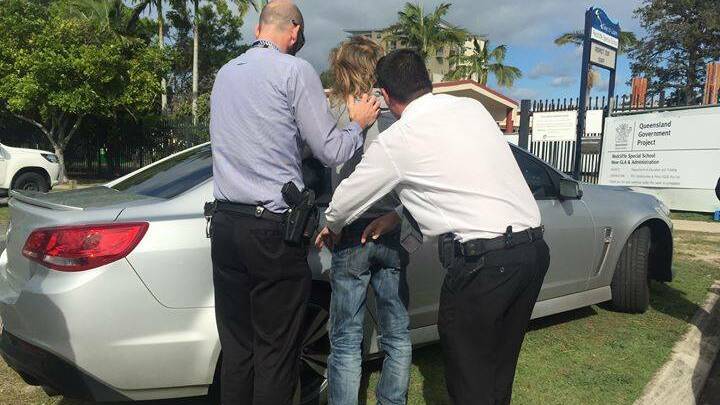 Arrested: A 61-year-old man at a home at Redcliffe, Queensland. Image credit: NSW Police Force.