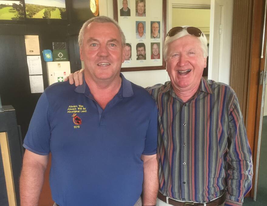Parkes Golf Club Captain Peter Dixon congratulates Saturday's winner Warren Blatch.