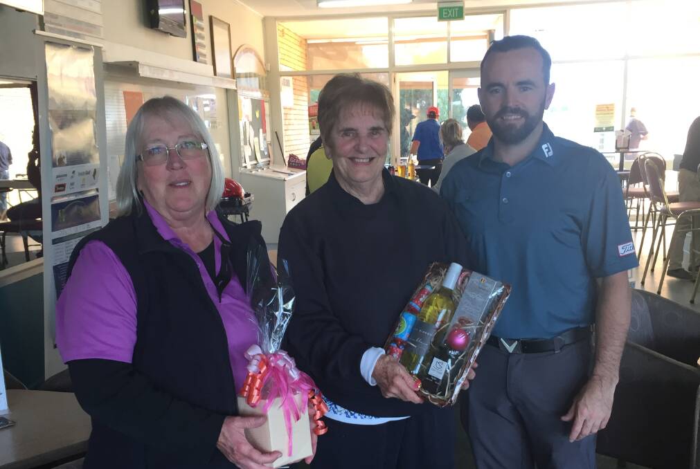 Saturday winner Dale Matthews, Consistency Award winner Ann Berkeley are congratulated by new Parkes Golf Club professional Simon Houstin.