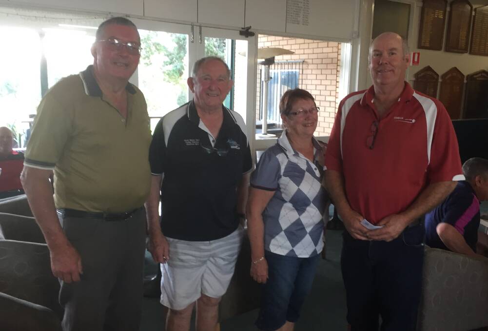 Ken Ryan (left) and Michael Hillman (right) are congratulated by Parkes Golf Club Life Members Cliff Cowell and Colleen Flynn.