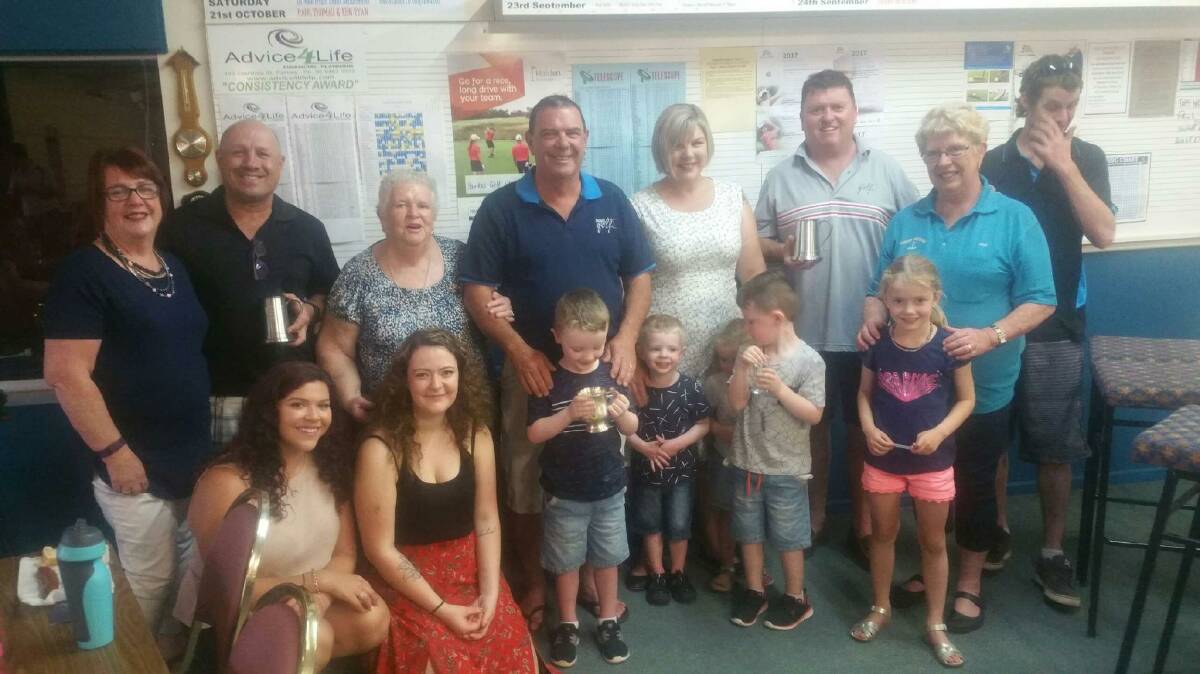 Mark Kelly (back, second from left) and Mick Horan (back, third from right) with the Smith family after the club's Bob Smith Memorial event.