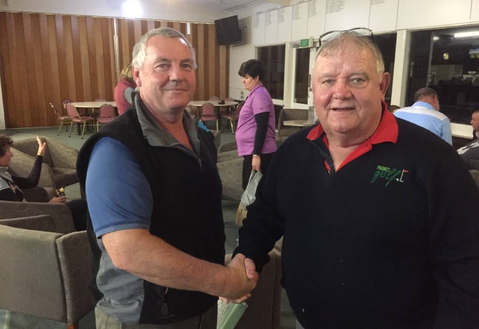 Incumbent Parkes Golf Club captain Peter Dixon thanks out-going captain Paul Thomas for all his efforts.