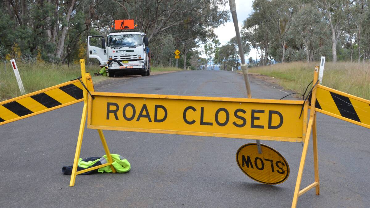 Crime scene: Council workers closed Elsmore Rd while police examined the crash scene. Photo: Laurie Bullock