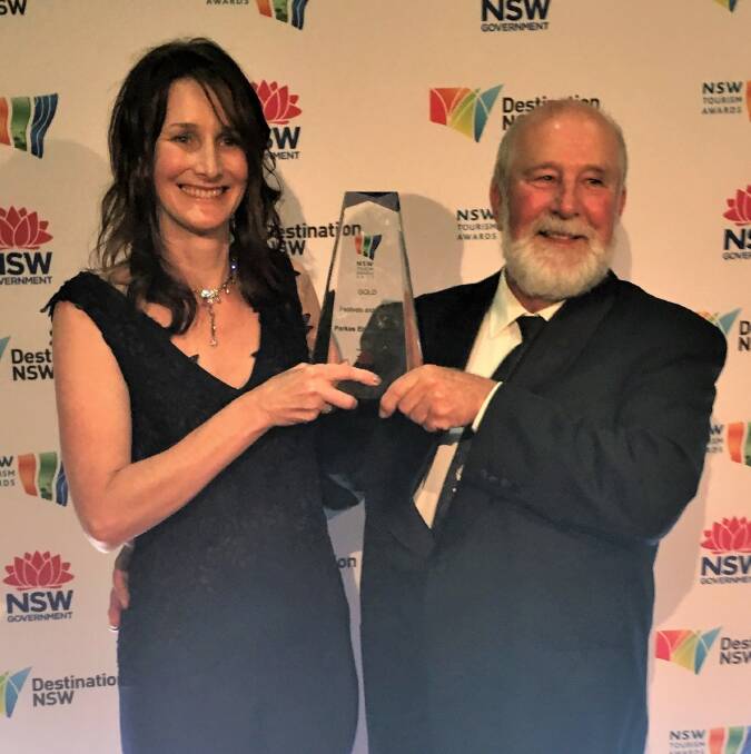 Cathy Treasure and mayor Ken Keith with the Gold Award presented to Parkes for the Elvis Festival at the annual NSW Tourism Awards in Sydney.