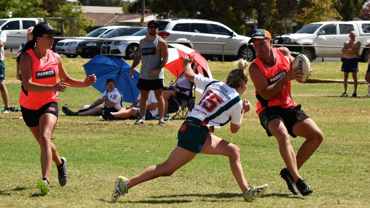 Demi Winter looks for a pass from Reece Frame in the touch football last weekend, playing for the Parkes All Starts mixed team.