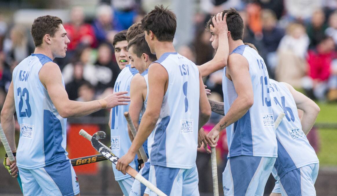UNDEFEATED CHAMPIONS: Hayden Dillon's NSW side celebrates a goal in its nervy gold medal game win over Queensland last week. Photo: CLICKINFOCUS
