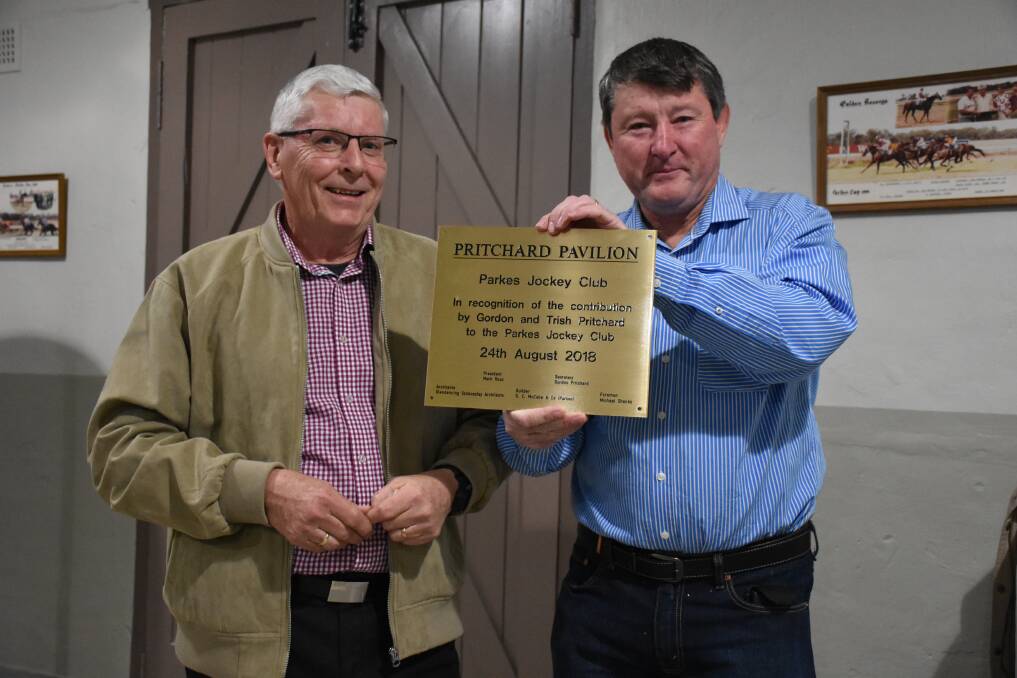 Recognition: Parkes Jockey Club Secretary Gordon Pritchard and President Mark Ross with the Pritchard Pavilion plaque, in recognition of Gordon's contributions. Photo: File.