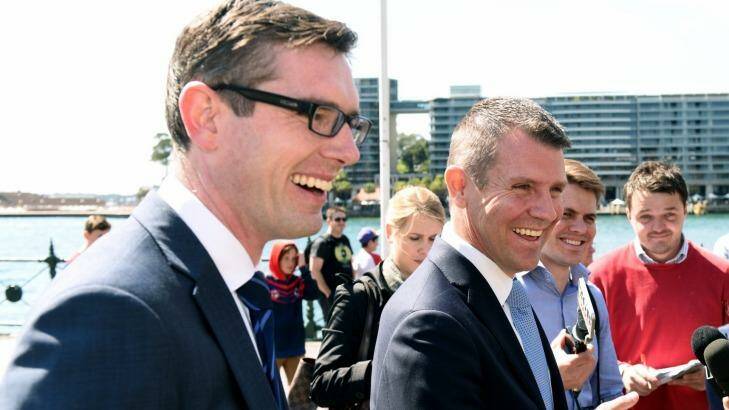 Finance Minister Dominic Perrottet and Premier Mike Baird remain under fire over the property acquisition process for WestConnex Photo: Steven Siewert
