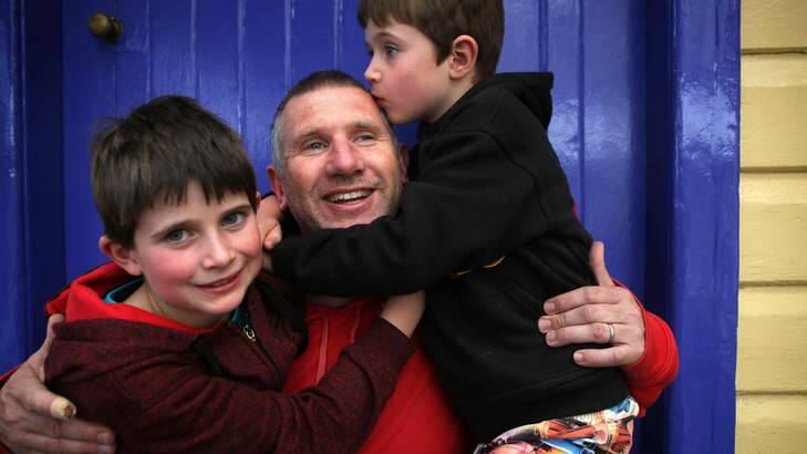 Making them happy: Tim Hamilton with Archie and Zachary. Photo: James Alcock