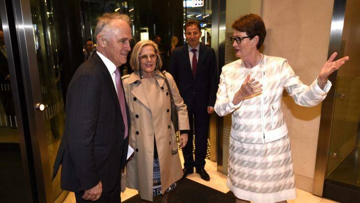 Prime Minister Malcolm Turnbull and his wife Lucy greeted by BCA President Catherine Livingstone AO as he arrives at the Business Council of Australia Annual Dinner at the Hilton Hotel in Sydney on Thursday night. Photo: Wolter Peeters