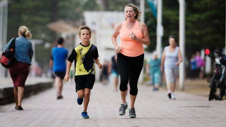 Annie White and her son Oli have been running along Manly Beach to get in shape for the big race. Photo: James Brickwood