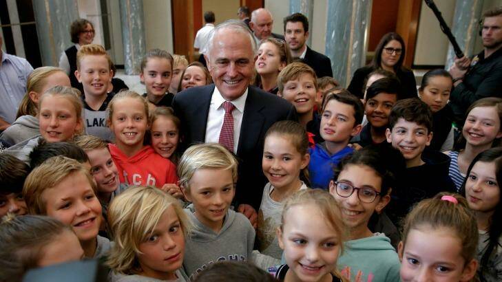 Malcolm Turnbull meets children in Parliament House's foyer after addressing the public service. Photo: Alex Ellinghausen