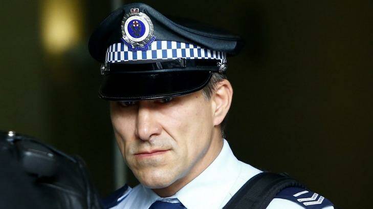 Senior Constable John Wasko leaves the Downing Centre Local Court on Tuesday. Photo: Daniel Munoz