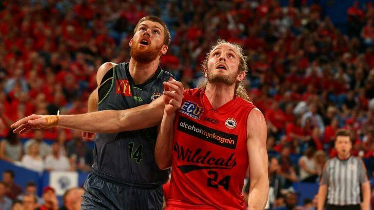 Perth Wildcat Jesse Wagstaff and Townsville's Brian Conklin battle at Perth Arena Photo: Paul Kane