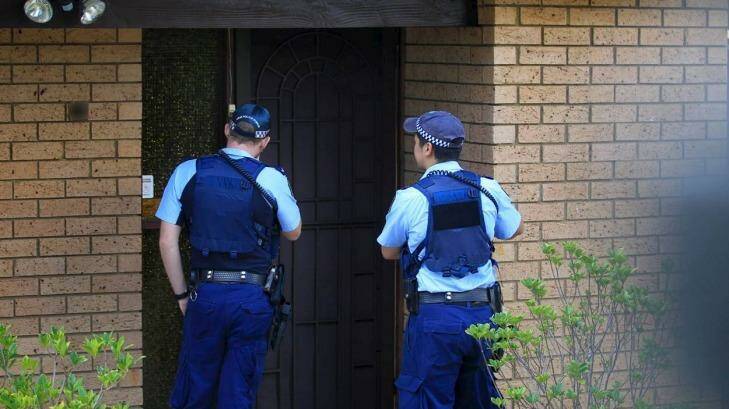 Police visit the Auburn home of a 16-year-old boy arrested over an alleged Anzac Day plot. Photo: James Alcock