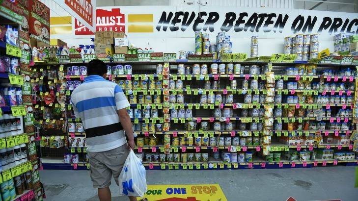 A man looks in the baby formula section of Chemist Warehouse in Campsie.  Photo: Kate Geraghty