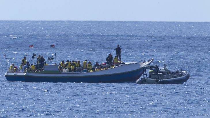 A boat carrying asylum seekers is intercepted by a Customs vessel off Christmas Island in August 2011. Photo: James Brickwood