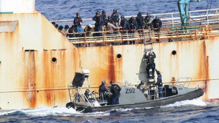 Australian officers investigate the illegal fisher Perlon in the Indian Ocean. Photo: Australian Border Force