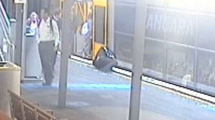 A man lies on the ground after falling while running for a train. Photo: Supplied