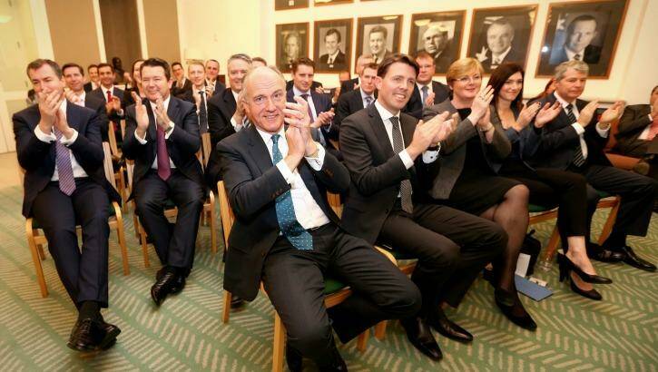 Senator Eric Abetz applauds as Mr Turnbull addresses the Coalition party room in Canberra. Photo: Alex Ellinghausen
