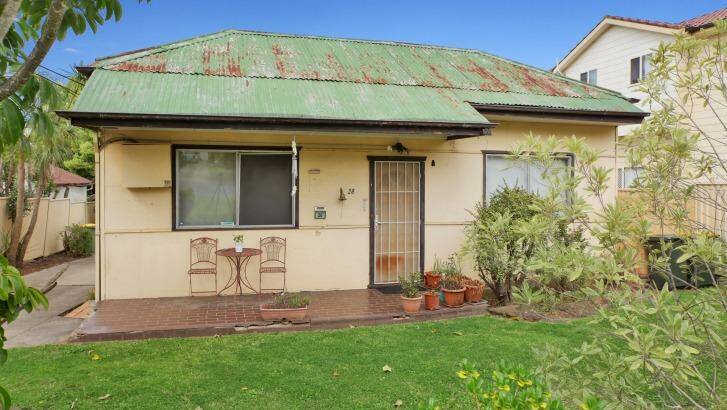 This house 28 Mary Street, Merrylands, didn't sell at auction for $800,000 and is now inviting offers at the same point. Photo: Jason Hall