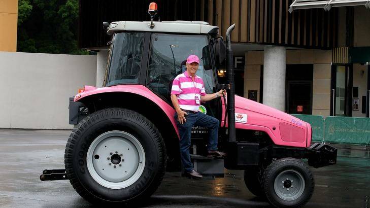 On the road to beating breast cancer: Hugh Bateman and his pink tractor. Photo: Ben Rushton