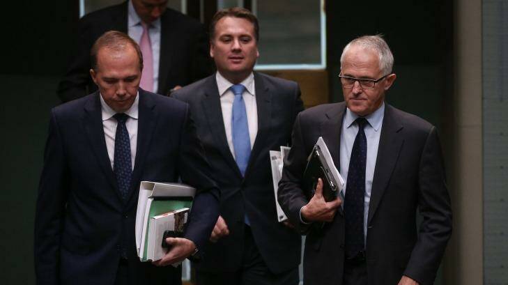 Peter Dutton, Jamie Briggs and Malcolm Turnbull arrive for question time earlier this year. Photo: Alex Ellinghausen