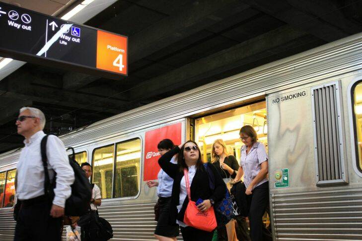 Train commuters use Queensland Rail trains in Brisbane. Photo: Jorge Branco