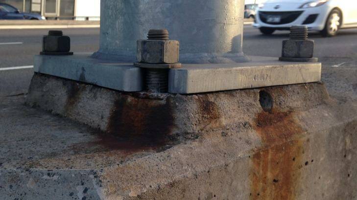 Signs of rust and discoloration at the bases of the bridge light towers. Photo: Patrick Begley