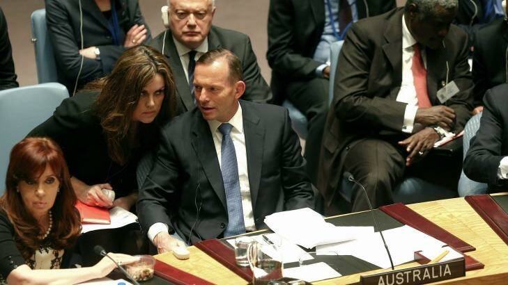 Tony Abbott speaks with his chief of staff, Peta Credlin, at a UN Security Council in New York. Photo: Alex Ellinghausen